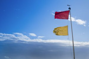 Hazard warning flags at sea