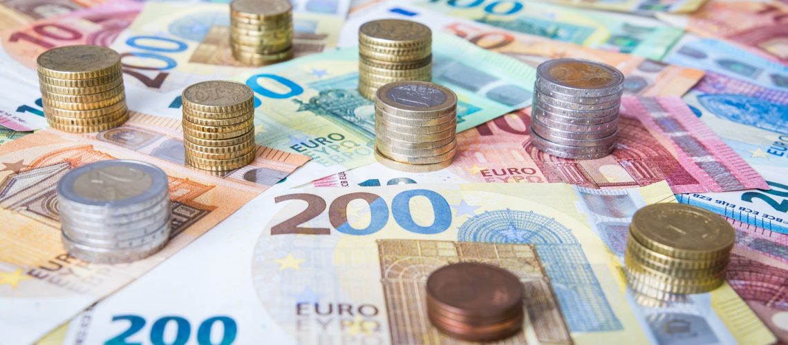 A combination of different Euro banknotes and Euro coins