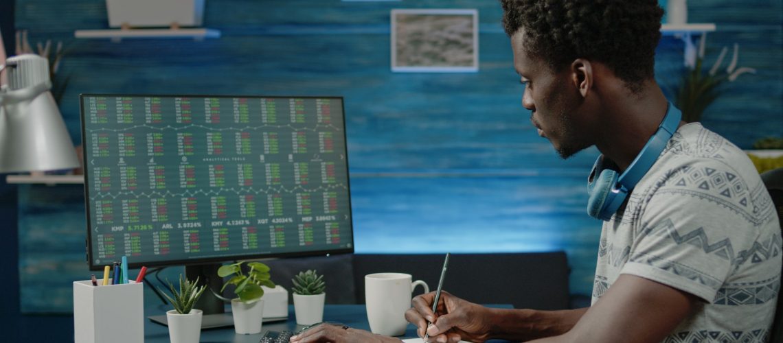 Person looking at stock market trading data on computer