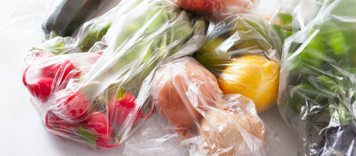 single use plastic waste issue. fruits and vegetables in plastic